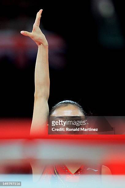 Bronze medalist Wenna He of China finishes her routine during Trampoline on Day 8 of the London 2012 Olympic Games at North Greenwich Arena on August...