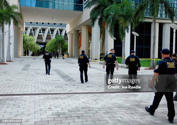 Department of Homeland Security police walk around the Wilkie D. Ferguson Jr. United States Federal Courthouse before the arraignment of former...