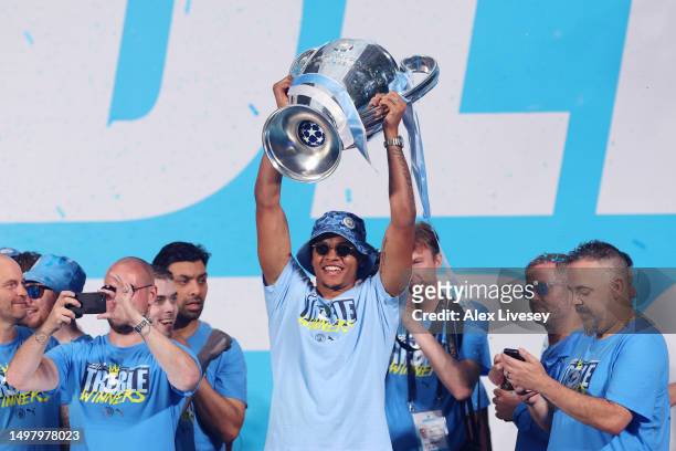 Manuel Akanji of Manchester City celebrates with the UEFA Champions League Trophy on stage in St Peter's Square during the Manchester City trophy...