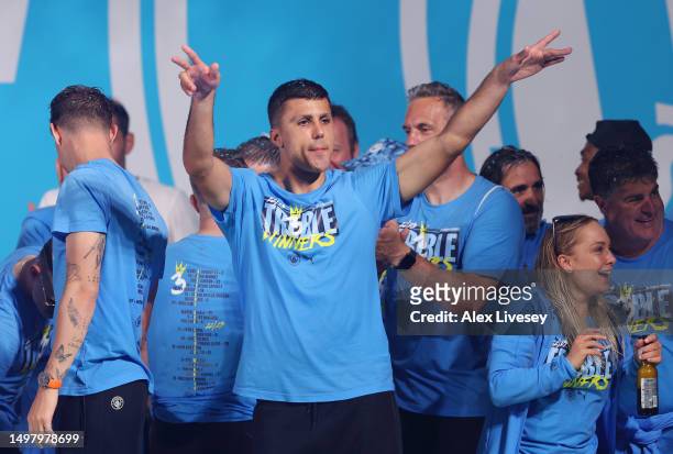 Rodri of Manchester City celebrates on stage in St Peter's Square during the Manchester City trophy parade on June 12, 2023 in Manchester, England.