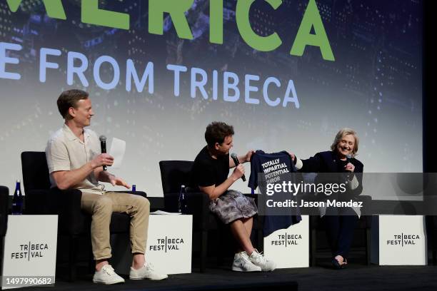 Tommy Vietor, Jon Lovett and Hillary Clinton speak after the "Pod Save America Live" event during the 2023 Tribeca Festivalat BMCC Theater on June...