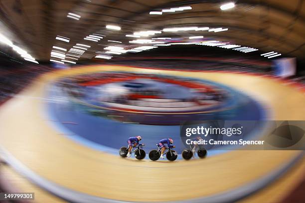 Dotsie Bausch, Jennie Reed and Sarah Hammer of the United States in action during the Women's Team Pursuit Track Cycling First Round heat against...