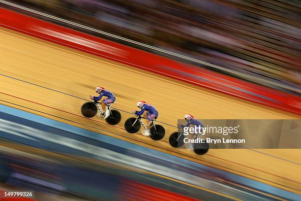 Dotsie Bausch, Jennie Reed and Sarah Hammer of the United States in action during the Women's Team Pursuit Track Cycling First Round heat against...