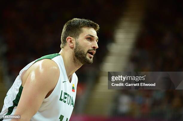 Linas Kleiza of Lithuania looks on against the United States during their Basketball Game on Day 8 of the London 2012 Olympic Games at the Olympic...