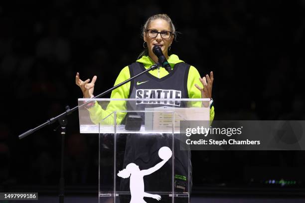 Jenny Boucek speaks during Sue Bird's jersey retirement ceremony after the game between the Seattle Storm and the Washington Mystics at Climate...