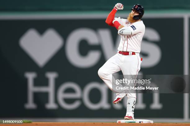 Justin Turner of the Boston Red Sox celebrates after hitting a RBI double during the sixth inning against the Colorado Rockies at Fenway Park on June...