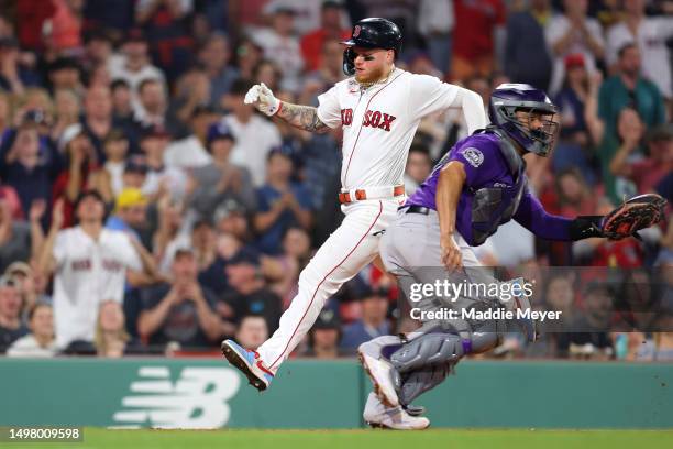 Alex Verdugo of the Boston Red Sox scores a run past Elias Diaz of the Colorado Rockies during the sixth inning at Fenway Park on June 12, 2023 in...
