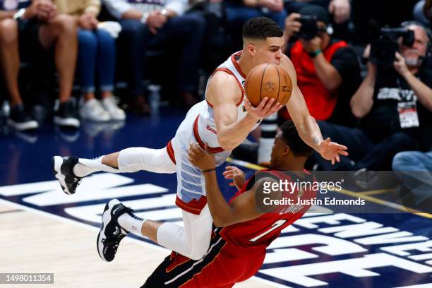 Michael Porter Jr. #1 of the Denver Nuggets drives to the basket against Kyle Lowry of the Miami Heat during the first quarter in Game Five of the...