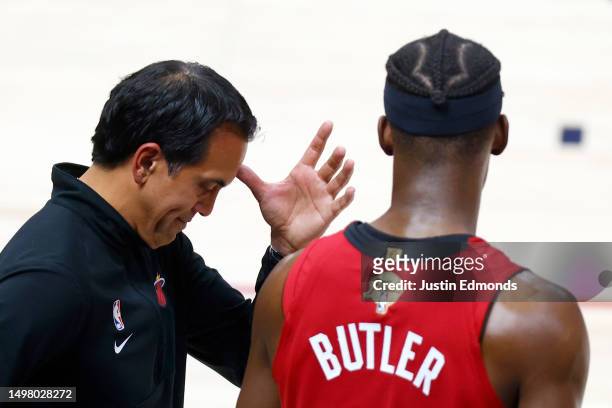 Head coach Erik Spoelstra of the Miami Heat reacts with Jimmy Butler during the fourth quarter against the Denver Nuggets in Game Five of the 2023...