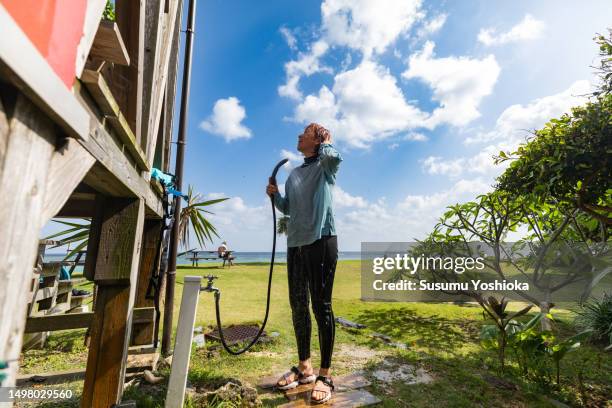 a woman staying at a resort inn on a southern island. - 鹿児島県 fotografías e imágenes de stock