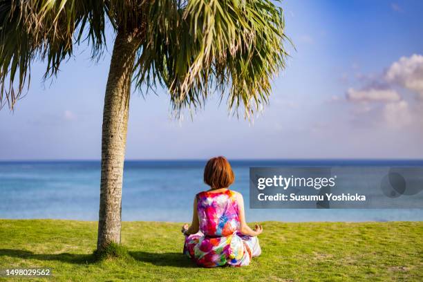 a woman staying at a resort inn on a southern island. - 鹿児島県 stock pictures, royalty-free photos & images