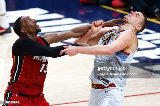 Bam Adebayo of the Miami Heat battles Nikola Jokic of the Denver Nuggets during the fourth quarter in Game Five of the 2023 NBA Finals at Ball Arena...