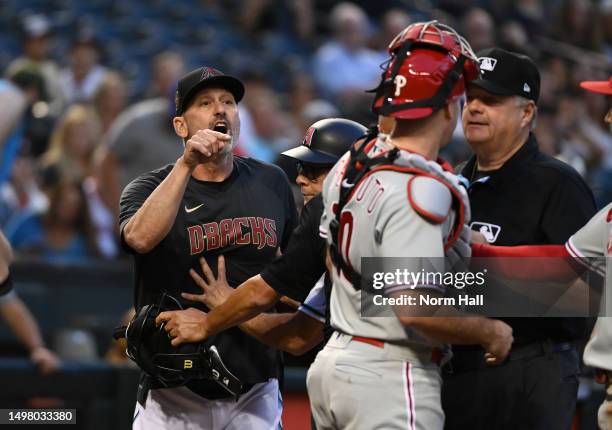 Manager Torey Lovullo of the Arizona Diamondbacks yells at JT Realmuto of the Philadelphia Phillies after being ejected from the game during the...