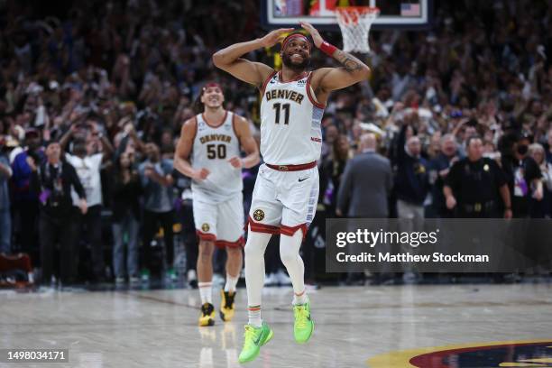 Bruce Brown and Aaron Gordon of the Denver Nuggets celebrate after a 94-89 victory against the Miami Heat in Game Five of the 2023 NBA Finals at Ball...