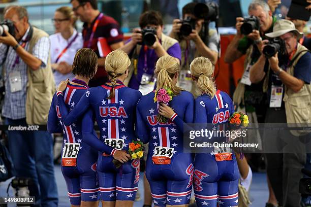 Lauren Tamayo, Dotsie Bausch, Jennie Reed and Sarah Hammer of the United States receive their Silver medal during the medal ceremony for the Women's...