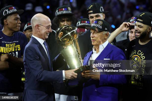 Commissioner Adam Silver presents the Larry O'Brien Championship Trophy to Denver Nuggets owner Stan Kroenke after the 94-89 victory against the...