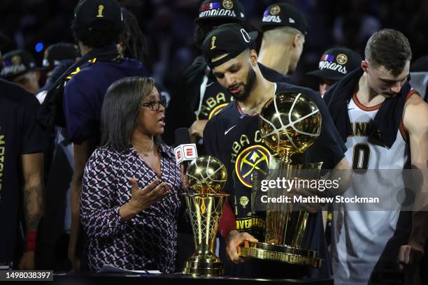 Jamal Murray of the Denver Nuggets is interviewed holding the Larry O'Brien Championship Trophy after a 94-89 victory against the Miami Heat in Game...