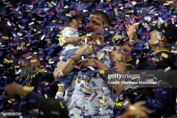 Nikola Jokic of the Denver Nuggets celebrates with his daughter Ognjena after a 94-89 victory against the Miami Heat in Game Five of the 2023 NBA...