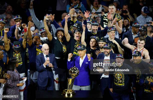 The Denver Nuggets celebrate with the Larry O'Brien Championship Trophy after a 94-89 victory against the Miami Heat in Game Five of the 2023 NBA...