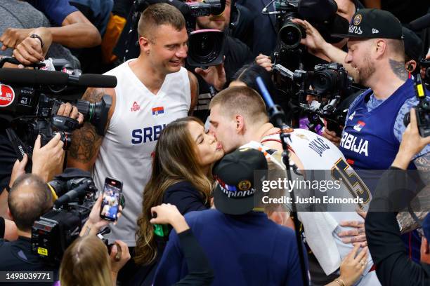 Nikola Jokic of the Denver Nuggets celebrates with his family after a 94-89 victory against the Miami Heat in Game Five of the 2023 NBA Finals to win...