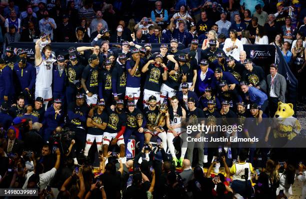 The Denver Nuggets pose for a team photo with the Larry O'Brien Championship Trophy after a 94-89 victory against the Miami Heat in Game Five of the...