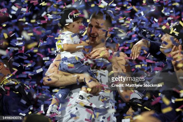 Nikola Jokic of the Denver Nuggets celebrates with his daughter Ognjena after a 94-89 victory against the Miami Heat in Game Five of the 2023 NBA...