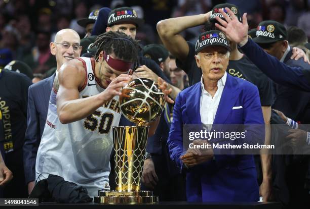 The Denver Nuggets celebrate with the Larry O'Brien Championship Trophy after a 94-89 victory against the Miami Heat in Game Five of the 2023 NBA...