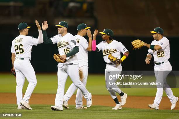 Jonah Bride, Seth Brown, Jace Peterson, Esteury Ruiz and Ramon Laureano of the Oakland Athletics celebrate after a 4-3 win against the Tampa Bay Rays...