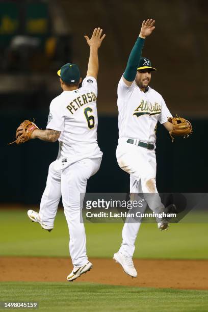 Jace Peterson and Kevin Smith of the Oakland Athletics celebrate a 4-3 win against the Tampa Bay Rays at RingCentral Coliseum on June 12, 2023 in...