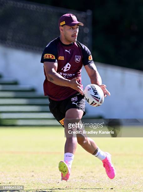 Valentine Holmes passes the ball during a Queensland Maroons State of Origin training session at the Clive Berghofer Centre on June 13, 2023 in...