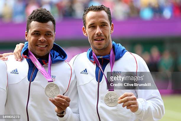 Jo-Wilfried Tsonga and Michael Llodra of France pose with their silver medals after the Men's Doubles Tennis final match on Day 8 of the London 2012...
