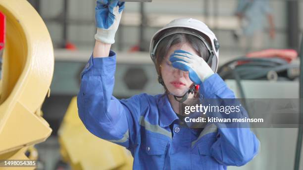 female industrial engineer or technician had accident or fainting due to hot weather and fell to floor while working, check the work system of robotic arm at production line in factory. an occupational health and safety in industrial factory. injury and a - fainting stock pictures, royalty-free photos & images