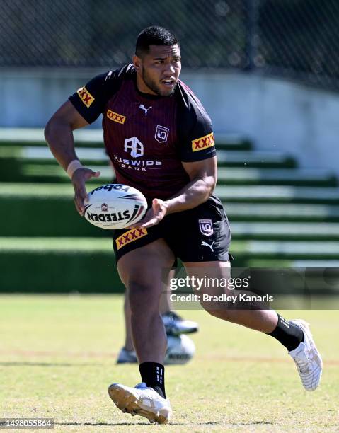 Moeaki Fotuaika passes the ball during a Queensland Maroons State of Origin training session at the Clive Berghofer Centre on June 13, 2023 in...