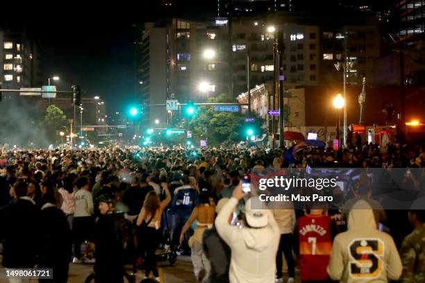 Denver Nuggets fans celebrate in downtown Denver after the end of Game Five of the 2023 NBA Finals at Ball Arena on June 12, 2023 in Denver,...