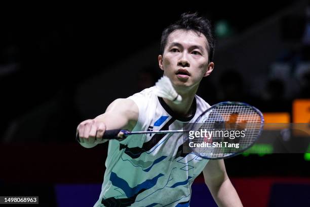 Ng Ka Long Angus of Hong Kong competes in the Men's Singles First Round match against Kento Momota of Japan on day one of the Indonesia Open 2023 at...