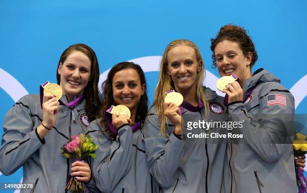 Gold medallists Missy Franklin, Rebecca Soni, Dana Volmer, and Allison Schmitt of the United States pose on the podium during the medal ceremony for...