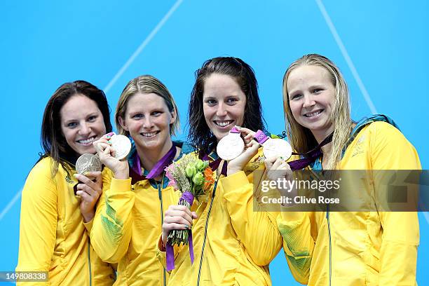 Silver medallists Emily Seebohm, Leisel Jones, Alicia Coutts and Melanie Schlanger of Australia pose on the podium during the medal ceremony for the...