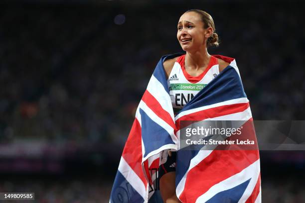Jessica Ennis of Great Britain celebrates winning gold in the Women's Heptathlon on Day 8 of the London 2012 Olympic Games at Olympic Stadium on...
