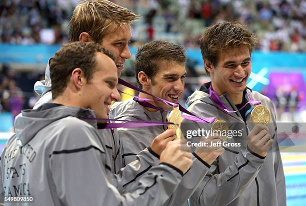 Gold medallists Brendan Hansen, Matthew Grevers, Michael Phelps and Nathan Adrian of the United States pose following the medal ceremony for the...