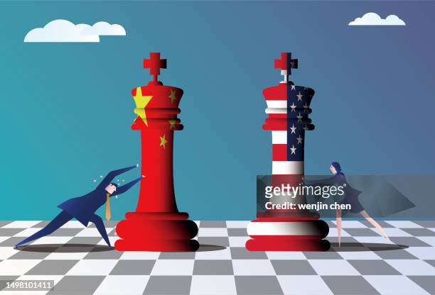 business man pushes american chess pieces and business woman pushes chinese chess pieces to compete, concept map of sino-us competition. - bishop chess piece stock illustrations