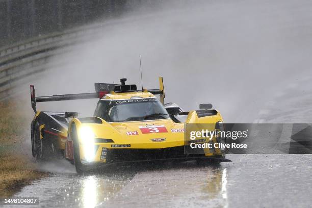 The Cadillac Racing Cadillac V-Series.R driven by Sebastien Bourdais, Renger van der Zande and Scott Dixon spins out during a heavy rain shower...