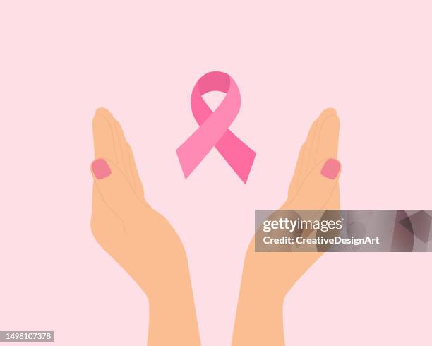hands with pink ribbon. breast cancer awareness concept - world cancer day stock illustrations