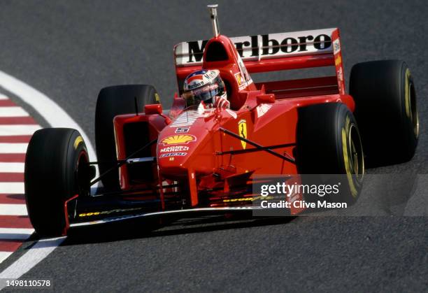 Michael Schumacher of Germany drives the Scuderia Ferrari Marlboro Ferrari F310B Ferrari V10 during practice for the Formula One Japanese Grand Prix...