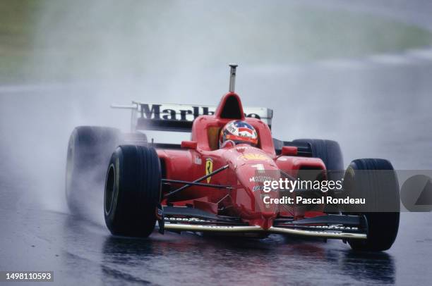 Michael Schumacher from Germany drives the Scuderia Ferrari Ferrari F310 Ferrari V10 in the rain during the Formula One Spanish Grand Prix on 2nd...