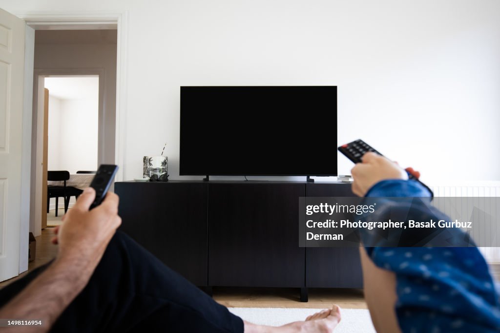 Watching TV, using remote control