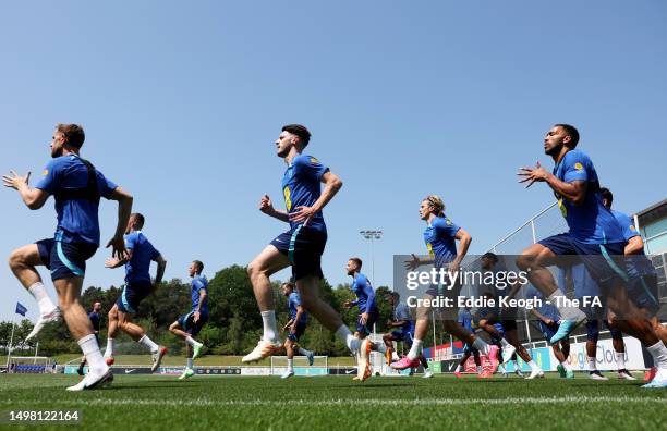 Players of England warm up during a training session at St Georges Park on June 13, 2023 in Burton-upon-Trent, England.