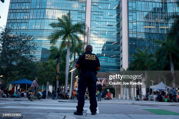 Department of Homeland Security police officer stands near the Wilkie D. Ferguson Jr. United States Federal Courthouse before the arraignment of...