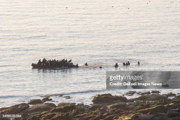 Equihen-Plage, France, : Refugees attempt to flee to the UK aboard an inflatable boat on June 10, 2023 in Equihen-Plage, France.