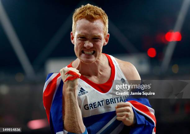 Greg Rutherford of Great Britain celebrates winning gold in the Men's Long Jump Final on Day 8 of the London 2012 Olympic Games at Olympic Stadium on...