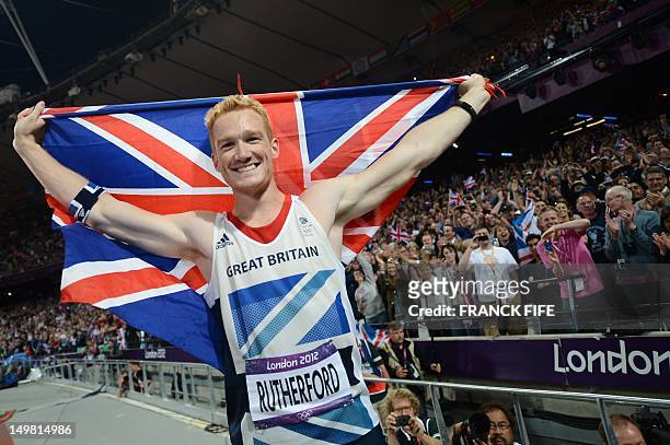 Gold medalist Britain's Greg Rutherford celebrates after winning the men's long jump at the athletics event of the London 2012 Olympic Games on...